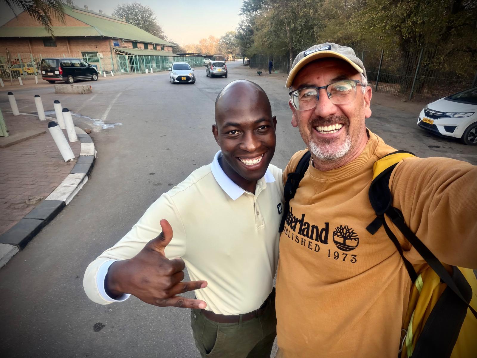 Heavenly Travel Concierge hosts greeting a guest in Victoria Falls